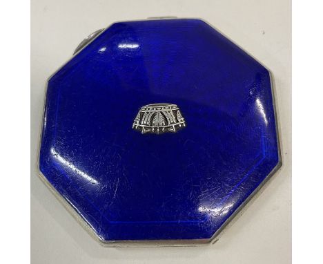A silver and blue enamelled compact embossed with a crown to the centre. Birmingham 1940. By JWB. Approx.109 grams. Est. £100