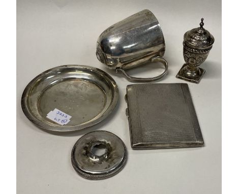 A heavy engine turned silver cigarette case together with a cup etc. Approx. 233 grams. Est. £80 - £120.