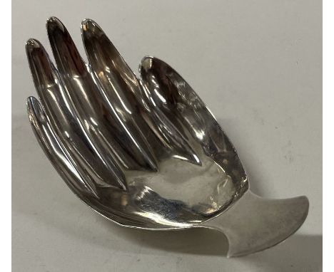 A George III silver caddy spoon with fluted bowl in the form of a hand. London 1806. Approx. 7 grams. Est. £200 - £300.