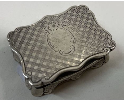 A Victorian engine turned silver vinaigrette. Birmingham 1863. By Edward Smith. Approx. 24 grams. Est. £200 - £250.
