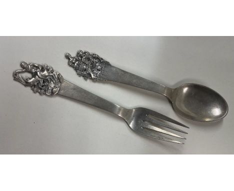 A Danish silver christening fork and spoon. Approx. 60 grams. Est. £50 - £80. 