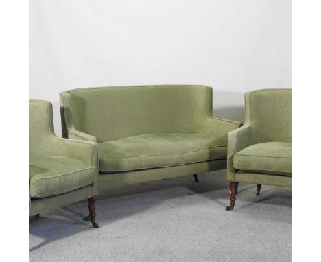 An Edwardian green upholstered three piece suite, comprising a sofa and a pair of chairs, on turned legsSofa 141w x 70d x 90h