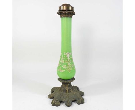 A 19th century green glass candle lamp base, with painted decoration, on an ornate brass base, 41cm high