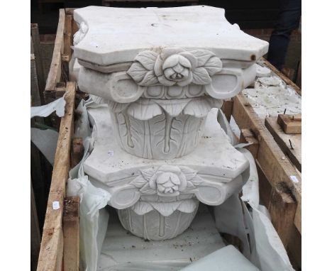 A pair of carved marble Corinthian column architectural capitals, together with another pair, each 30cm high (4)