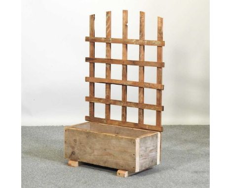A small garden planter with trellis66w x 30d x105h cm