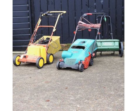 A Bosch lawnmower, together with a Wolf Tools scarifier, garden spreader and strimmer (4)