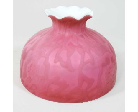 A small red satin glass oil lamp shade, with stylised decoration, 10cm highCondition report: Dirty, with very light general s