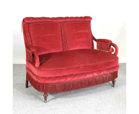 A Victorian red upholstered sofa, with scrolled arms, on turned legs122w x 70d x 93h cmCondition report: Overall is solid and