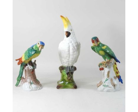 A large Dresden pottery model of a parrot, 30cm high, together with another and an Italian pottery bird (3)Condition report: 