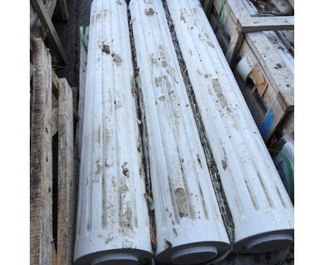A set of three white marble architectural columns, each with fluted decoration (3)