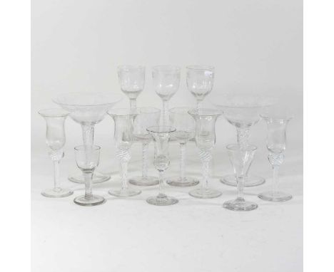 A set of five double series opaque twist wine glasses, each having engraved decoration, 16cm high, together with a collection