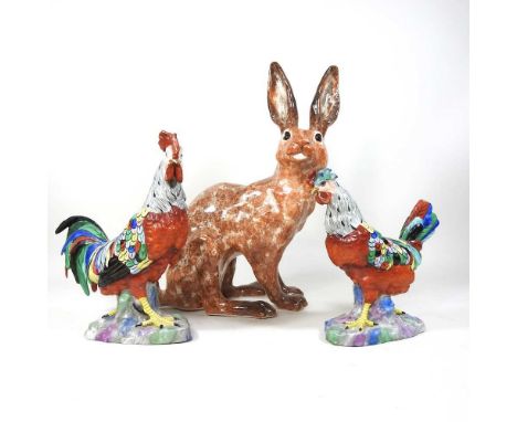 A Winstanley pottery model of a hare, 30cm high, together with two pottery chickens (3)Condition report: Hare is dirty, with 