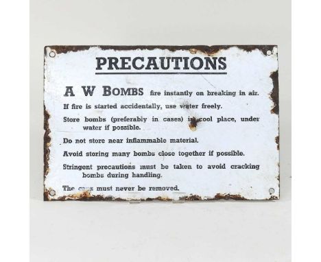 A World War II enamel sign, PRECAUTIONS, A W BOMBS, 20 x 31cm