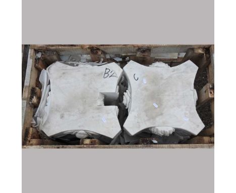A pair of carved marble architectural Corinthian capitals, together with another pair, each 31cm high