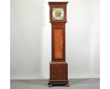 A good early 20th century longcase clock, having an inlaid case, the chased gilt twelve inch dial with chime silent and subsi