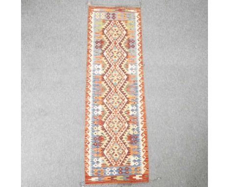 A Turkish kelim runner, with a row of central medallions, 200 x 63 cm