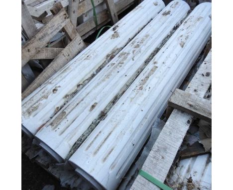 A set of three white marble architectural columns, each with fluted decoration, 141cm wide