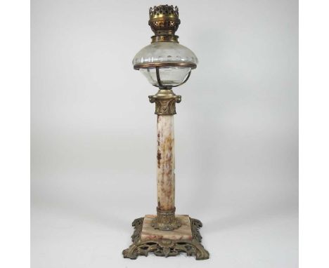 An Art Nouveau spelter and marble oil lamp base, in the form of a column, on a pierced base, with a clear glass reservoir, 58
