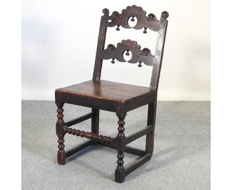 A late 17th century and later oak Derbyshire side chair, with a shaped ladder back, on bobbin turned legs47w x 95h cm