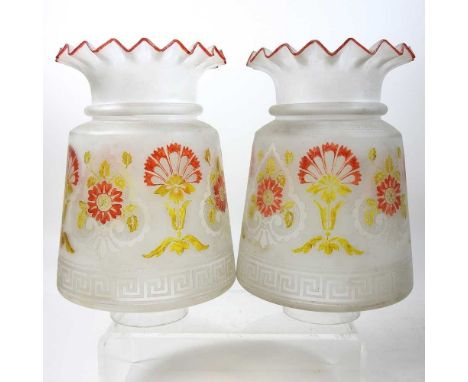 A pair of opaque glass oil lamp shades, decorated with flowers, 21cm high