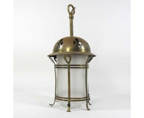 An early 20th century Art Nouveau pierced brass lantern, with an opaque glass shade, 41cm high