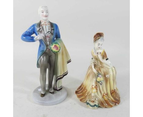 A Goldscheider style figure, of a gentleman, 24cm high, and a lady, 18cm high