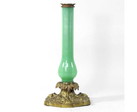 A 19th century green opaque glass candle lamp base, on an ornate scrolled brass base, 40cm highCondition report: Glass looks 