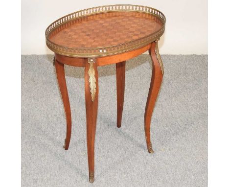 A French kingwood occasional table, 20th century, the parquetry top, with a pierced brass gallery46w x 32d x 59h cmCondition 