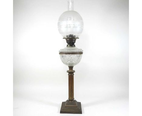 A 19th century brass Corinthian column oil lamp, with a cut glass reservoir and etched shade, 70cm high overall