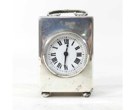 An early 20th century miniature silver carriage clock, with a white enamel dial, London 1914, 7cm highCondition report: Ticks