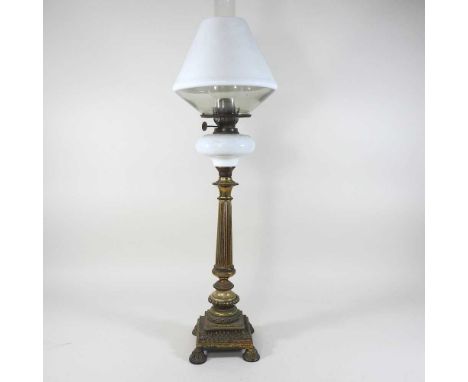 A 19th century gilt column oil lamp, with a white glass font and opaque glass shade, 69cm high overallCondition report: Looks