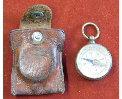 Compass - A small vintage pocket compass in leather case having the gold relief of East Dereham on the back, with suspender f
