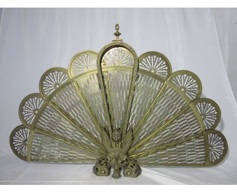 A 20th century brass fan shaped fire screen