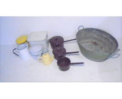 An assortment of enamel ware and a galvanised tin bath.