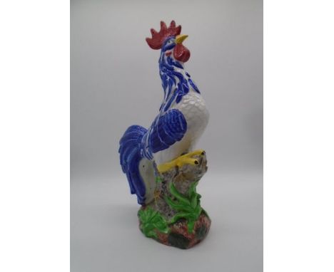 A large ceramic cockerel, with repair to crown. Approximate height 57cm 