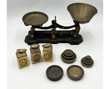 A set of painted scales along with a number of weights including broad arrow stamped examples, Avery etc.