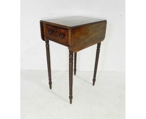 A Victorian sewing table raised on bobbin turned legs - missing fittings