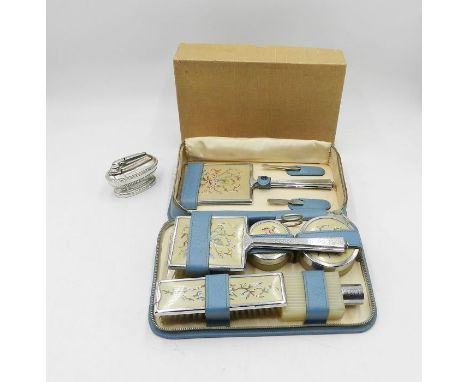 A Ronson table lighter along with a vintage boxed dressing table set