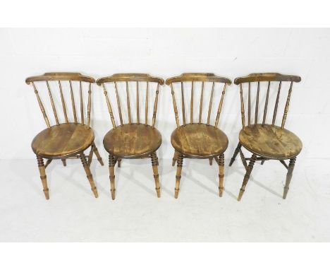 A set of four penny chairs on ring turned legs