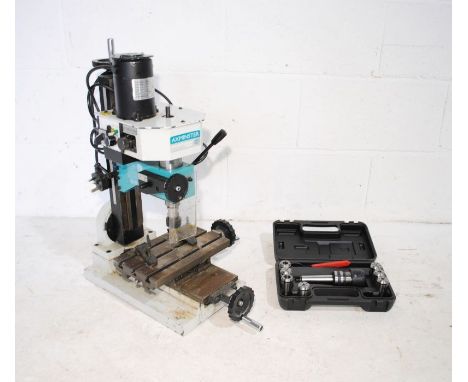 An Axminster Model Engineer Series vertical mill/pillar drill (model 505098) with boxed bit set