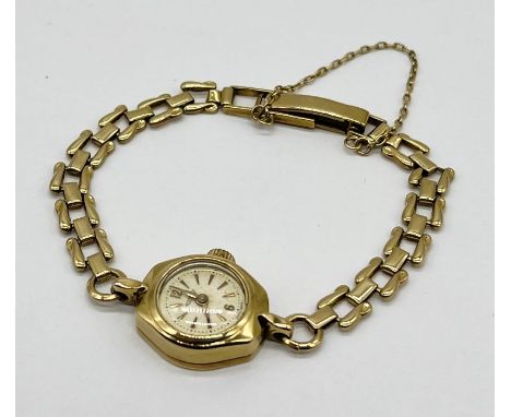 A ladies 9ct gold Rotary wristwatch with 9ct strap, total weight including movement 13.8g