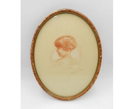 A framed pastel portrait of a young girl with indistinct signature - 42cm x 32cm