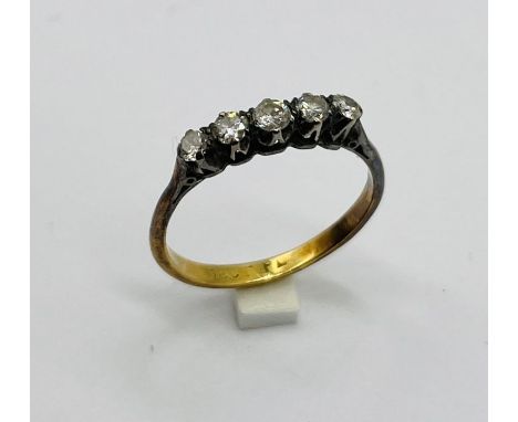 An 18ct gold and platinum diamond five stone ring 