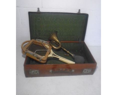 A vintage suitcase, Dunlop tennis racquet and a brass horn 