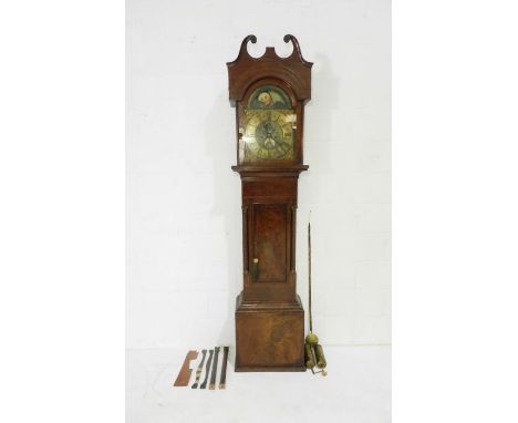 A Georgian inlaid mahogany longcase clock with barley twist supports and ornate brass dial with hand painted moon face showin