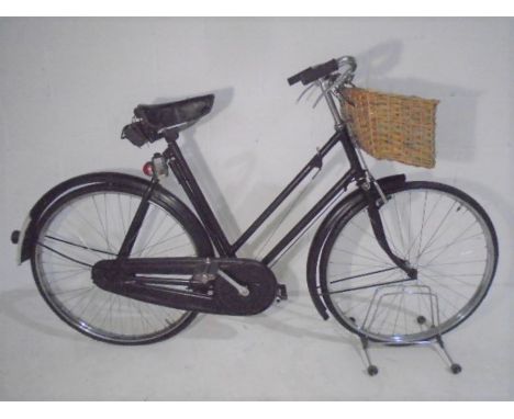 A vintage Raleigh ladies bicycle, with original accessories manuals, certificate etc