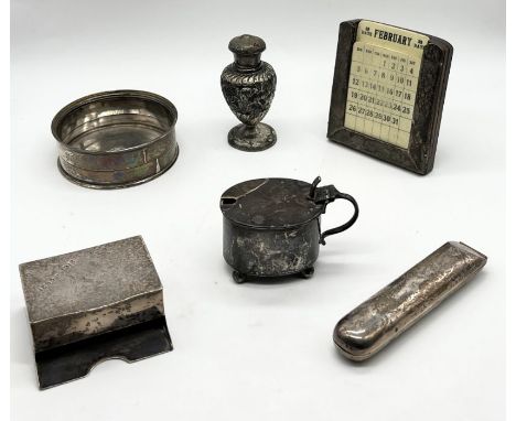 A collection of hallmarked silver items including a calendar, pepperette, mustard pot, thermometer etc. 