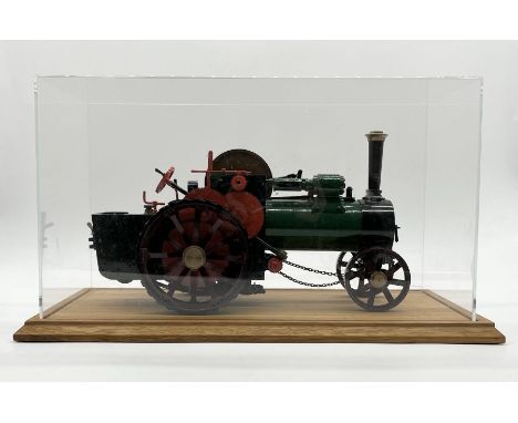 A 3/4 inch scale "Burrell" type agricultural live steam traction engine in display case 