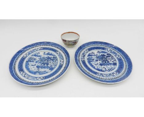 A pair of Chinese blue and white ceramic plates along with a famile rose tea bowl