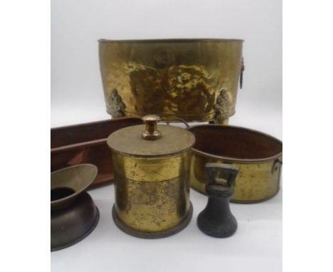 A brass oval coal bucket with lion head finials along with some brass and copper ware including a 1918 shell with broad arrow